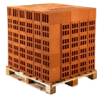 High solid concrete blocks stacked on a wooden pallet at a Ugandan construction site