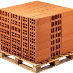 High solid concrete blocks stacked on a wooden pallet at a Ugandan construction site
